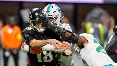 Miami Dolphins linebacker Jordyn Brooks sacks Atlanta Falcons quarterback Kirk Cousins. 