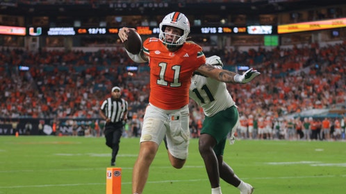 Miami Hurricanes QB Carson Beck running for a touchdown against South Florida at Hard Rock Stadium. (Photo credit: Sam Navarro-Imagn Images)