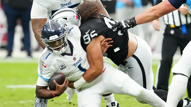 Las Vegas Raiders defensive tackle Leki Fotu sacks Tennessee Titans quarterback Cam Ward during Week 6.