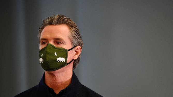Gavin Newsom wearing a COVID mask
