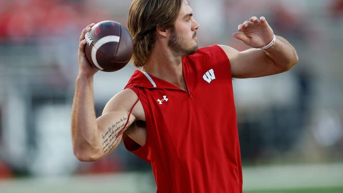 MADISON, WISCONSIN - AUGUST 28: Carter Smith #5 of the Wisconsin Badgers works out before game against the Miami (OH) Redhawks at Camp Randall Stadium on August 28, 2025 in Madison, Wisconsin. (Photo by John Fisher/Getty Images)