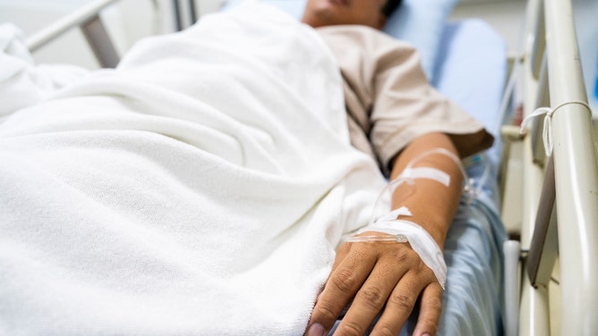 Influencer Athena Paris dancing next to father's hospital bed