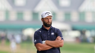 jon rahm with his arms crossed