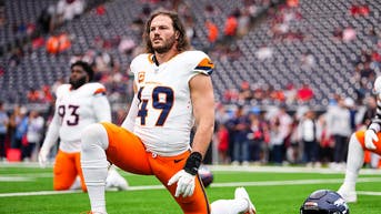 Denver Broncos' linebacker Alex Singleton stretching