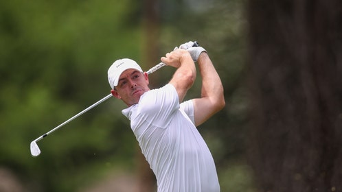 Rory McIlroy swinging an iron