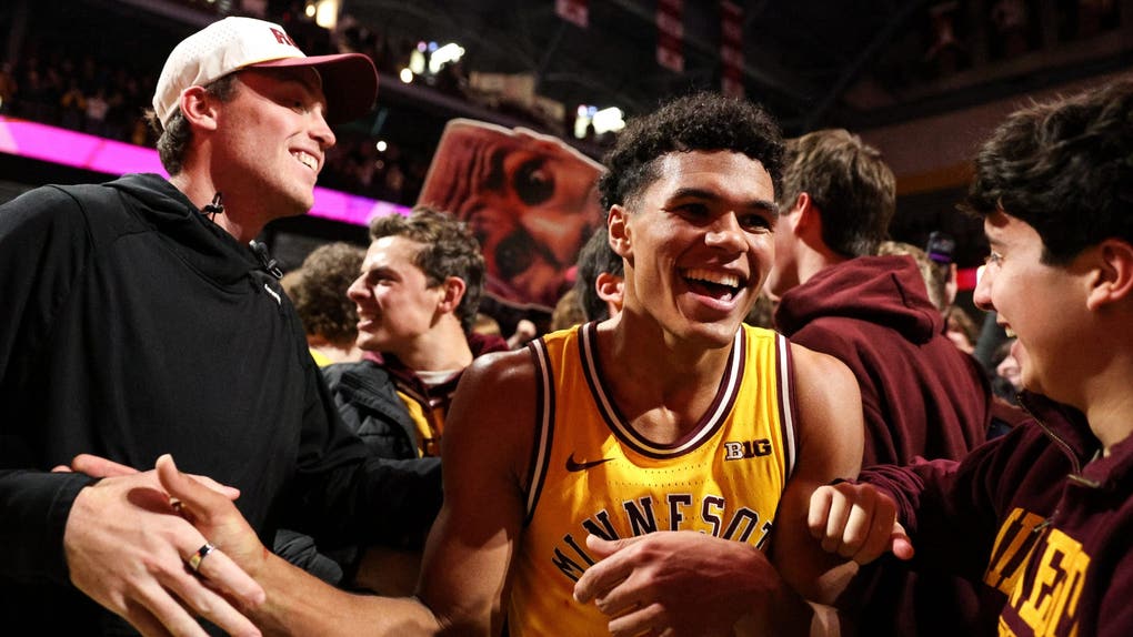 Minnesota Golden Gophers guard Isaac Asuma (1) celebrates with fans after the teams win against the Indiana Hoosiers after the game at Williams Arena.