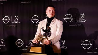 Diego Pavia with the Heisman Trophy