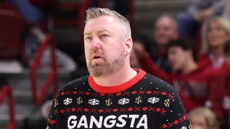 Queens basketball coach Grant Leonard wearing an awesome Christmas sweater