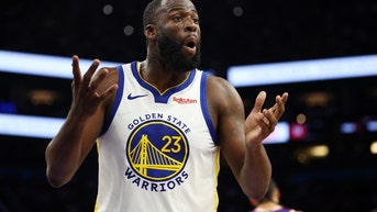 Draymond Green with his hands up