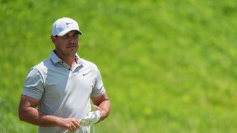 Brooks Koepka walking down the fairway