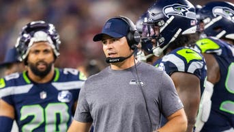 Seattle Seahawks head coach Mike Macdonald on the sideline during a game against the Arizona Cardinals at State Farm Stadium.