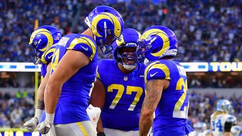 Los Angeles Rams players celebrate a touchdown against the Detroit Lions in Week 15.