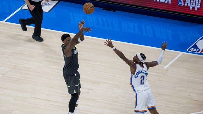 Minnesota Timberwolves SG Anthony Edwards shoots a 3-pointer over Oklahoma City Thunder's Shai Gilgeous-Alexander during Game 1 of the 2025 Western Conference Finals. (Photo Credit: Brett Rojo-Imagn Images)