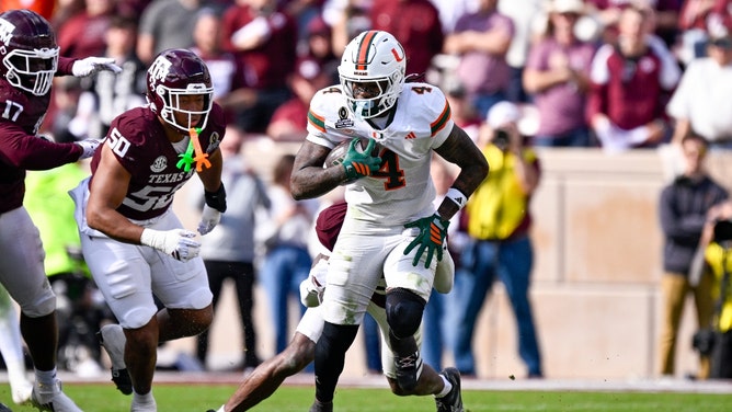 Miami Hurricanes RB Mark Fletcher Jr. carries the ball vs. the Texas A&M Aggies at Kyle Field in the first round of the 2025-26 College Football Playoff. (Photo credit: Jerome Miron-Imagn Images)