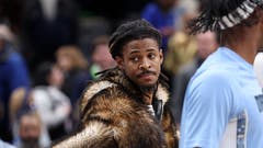 Ja Morant in a fur coat on the Grizzlies' bench