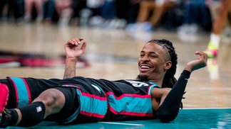 Ja Morant on the floor, laughing.