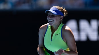 Amanda Anisimova smiling at the Aussie Open