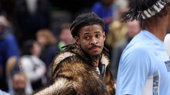 Ja Morant in a fur coat on the Grizzlies' bench