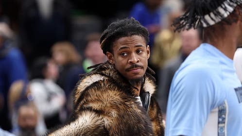 Ja Morant in a fur coat on the Grizzlies' bench