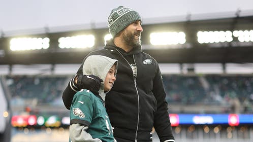 Head coach Nick Sirianni of the Philadelphia Eagles and his son, Jacob, take a photo before the NFC Wild Card Playoff game against the San Francisco 49ers at Lincoln Financial Field on January 11, 2026 in Philadelphia, Pennsylvania.