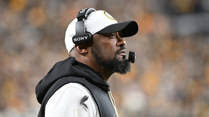 mike tomlin of the steelers looking on from the sideline