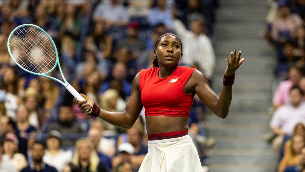 Coco Gauff with her hands up