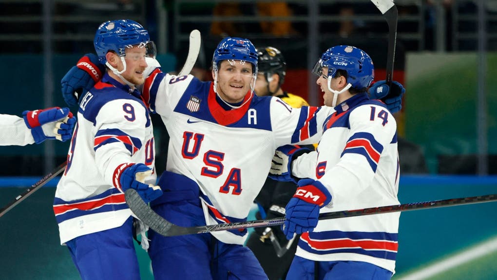 Brock Faber of United States celebrates scoring their third goal with teammates against Germany in men's ice hockey group C play during the Milano Cortina 2026 Olympic Winter Games at Milano Santagiulia Ice Hockey Arena.