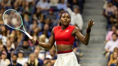 Coco Gauff with her hands up