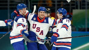 Brock Faber of United States celebrates scoring their third goal with teammates against Germany in men's ice hockey group C play during the Milano Cortina 2026 Olympic Winter Games at Milano Santagiulia Ice Hockey Arena.