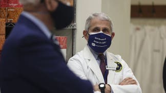 Anthony Fauci and Joe Biden wearing masks