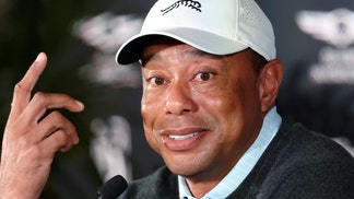 Tiger Woods speaking with the media.