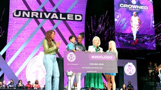 Chelsea Gray of the Rose receives the prize from Unrivaled Basketball Commissioner Micky Lawler after winning the Unrivaled 2026 1-on-1 Tournament presented by Sprite at Sephora Arena on February 14, 2026 in Medley, Florida. 