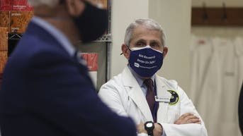 Anthony Fauci and Joe Biden wearing masks