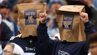 Tennessee Titans fans with paper bags on their heads