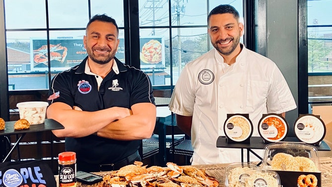 A photo of the owners of Jimmy's Famous Seafood, John and Tony Minadakis.