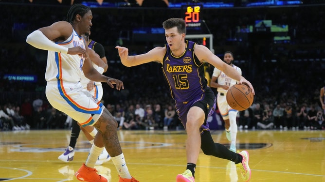 Lakers SG Austin Reaves drives into the paint against Oklahoma City Thunder wingJalen Williams at Crypto.com Arena in Los Angeles. (Photo credit: Kirby Lee-Imagn Images)