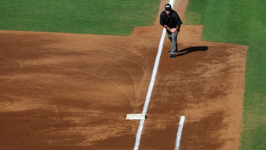 Baseball umpire on first base line