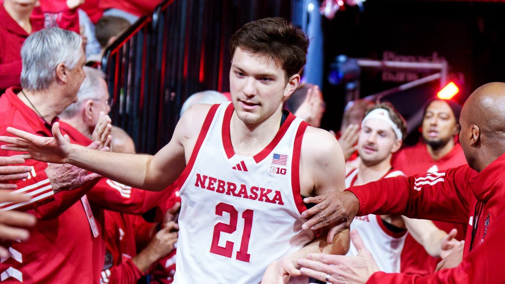 Nebraska Cornhuskers forward Pryce Sandfort (21) runs onto the court while being greeted by alumni players before the game against the Northwestern Wildcats at Pinnacle Bank Arena.
