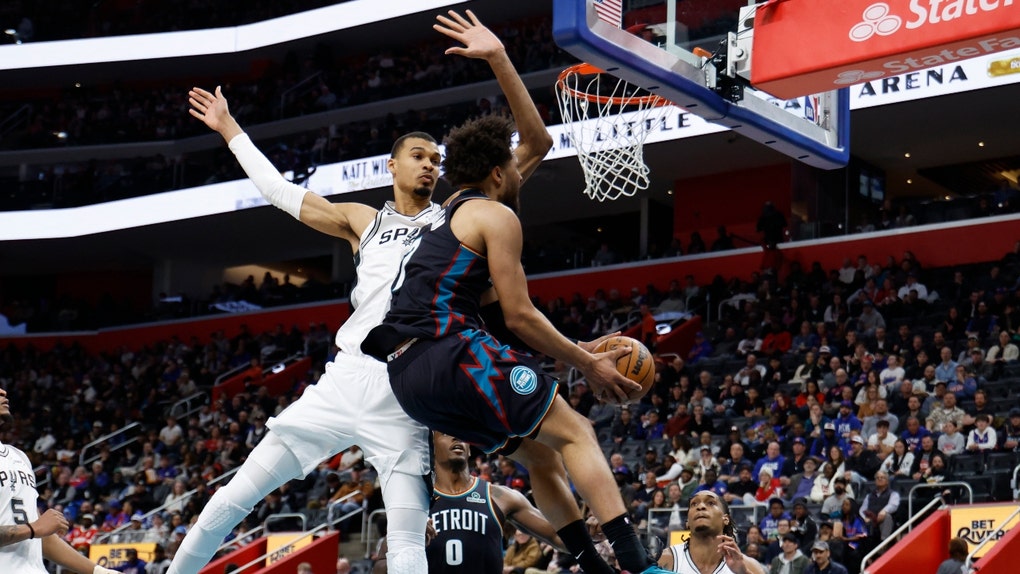 Detroit Pistons PG Cade Cunningham is fouled by San Antonio Spurs big Victor Wembanyama at Little Caesars Arena in Michigan. (Photo credit: Rick Osentoski-Imagn Images)