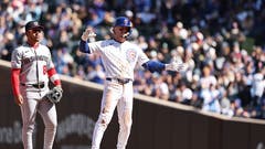 nico hoerner of the chicago cubs standing on second base