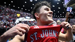 St. John's Red Storm guard Dylan Darling (0) celebrates after defeating the Kansas Jayhawks in the second half during a second round game of the men's 2026 NCAA Tournament at Viejas Arena.