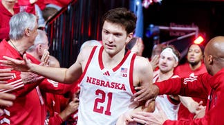 Nebraska Cornhuskers forward Pryce Sandfort (21) runs onto the court while being greeted by alumni players before the game against the Northwestern Wildcats at Pinnacle Bank Arena.