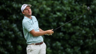 Russell Henley hitting a driver