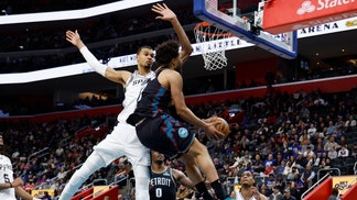 Detroit Pistons PG Cade Cunningham is fouled by San Antonio Spurs big Victor Wembanyama at Little Caesars Arena in Michigan. (Photo credit: Rick Osentoski-Imagn Images)