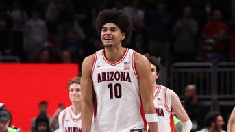 Arizona Wildcats forward Koa Peat (10) reacts after defeating the Houston Cougars during the men's Big 12 Conference Tournament Championship at T-Mobile Center.