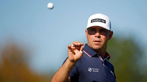 Gary Woodland catching a golf ball