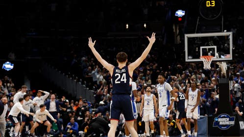 UConn Huskies guard Braylon Mullins (24) celebrates after making the game-winning three-point basket against the Duke Blue Devils in the second half during an Elite Eight game of the East Regional of the men's 2026 NCAA Tournament at Capital One Arena.
