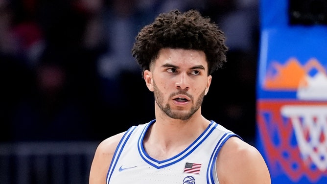 Duke Blue Devils forward Cameron Boozer (12) celebrates after a play against the Virginia Cavaliers during the men's ACC Conference Tournament Championship at Spectrum Center.