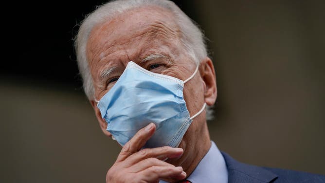 former President Joe Biden wearing a mask