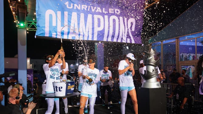 Mist guard Veronica Burton (22), guard Allisha Gray (15) and forward Alanna Smith (8) spray champagne after winning the Unrivaled championship game against the Phantom at Sephora Arena. 
